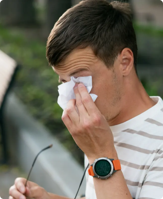 Man experiencing ocular allergy symptoms